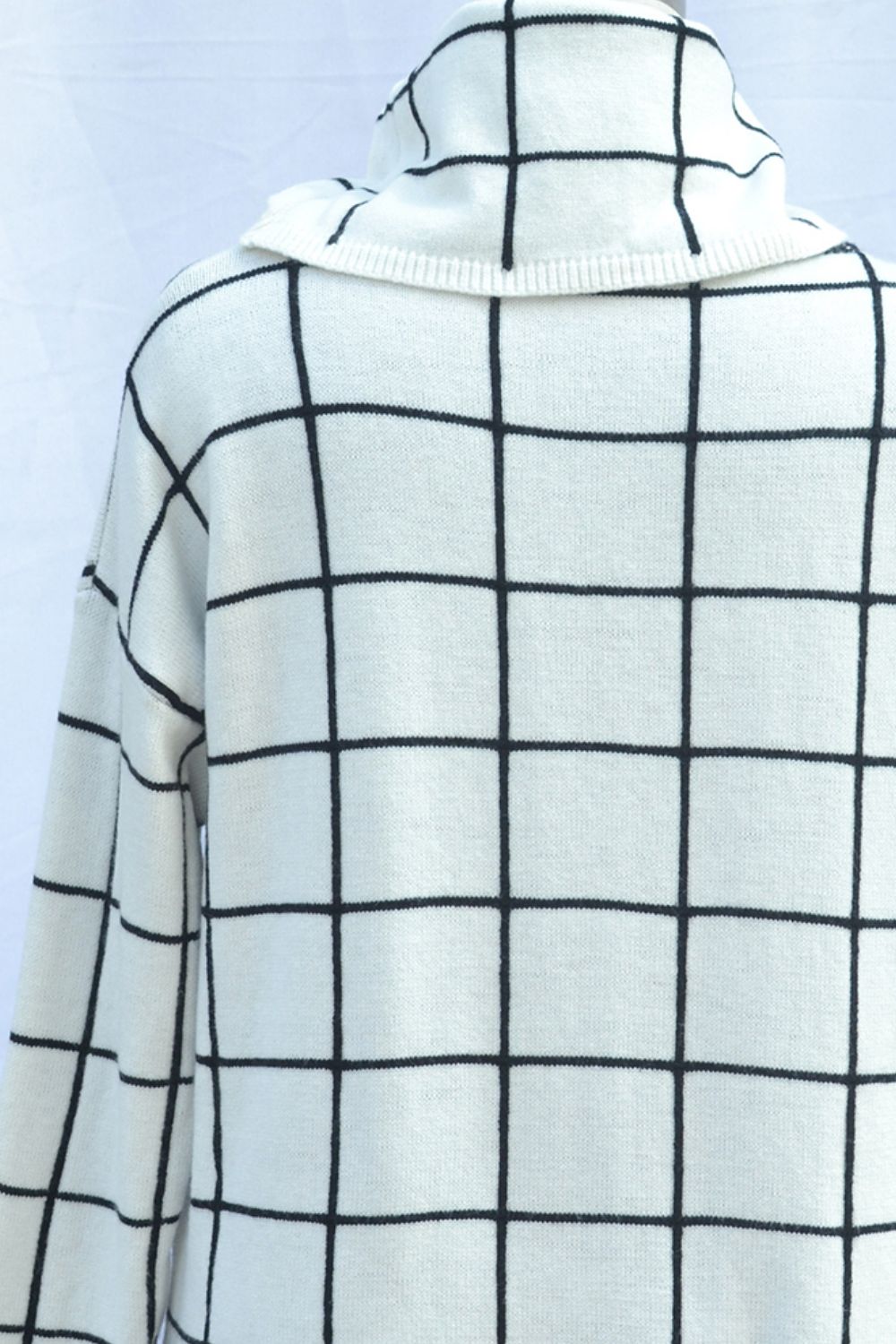 The Queens Court Turtleneck Windowpane Sweater