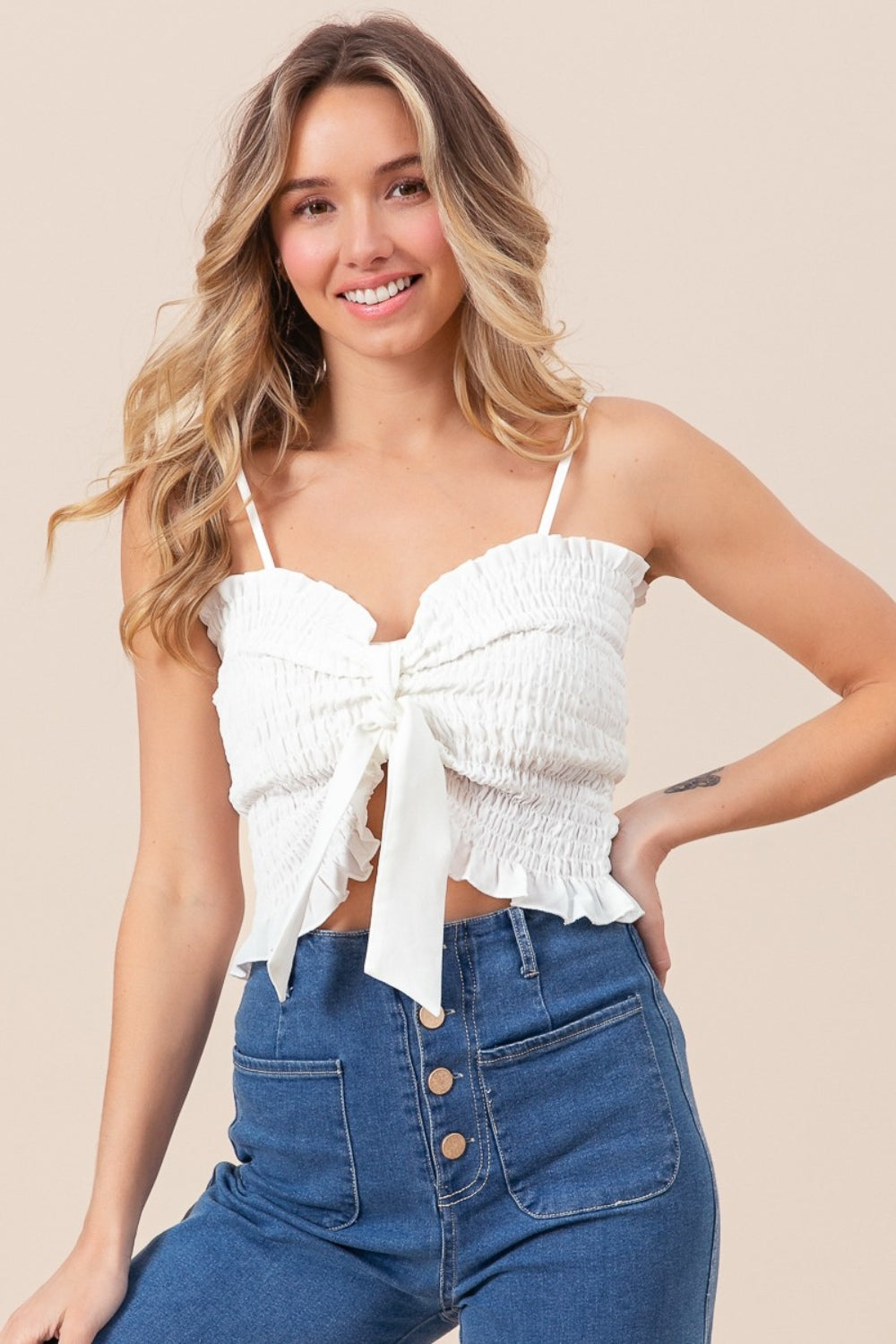 Sweetheart neckline cami spaghetti strap top with a bow